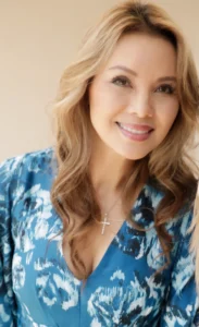 Kimberley Ngo, your trusted financial advisor, smiling in a blue blouse.